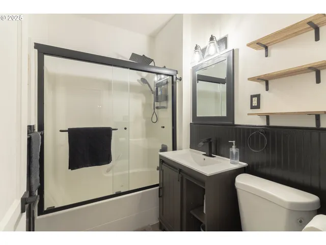 a bathroom with a sink and mirror