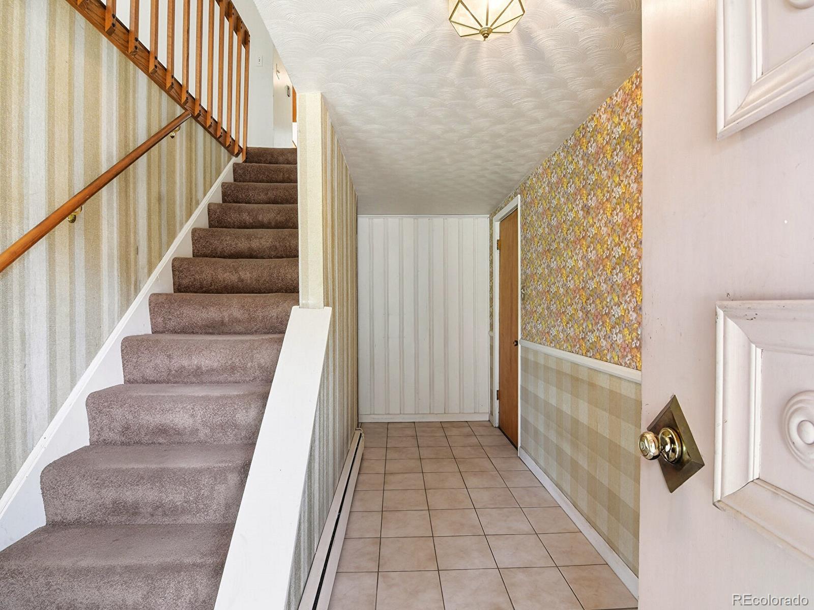 2830 Kerr Gulch Road Evergreen, CO 80439 - Photo 11 of 48 a view of entryway with stairs and furniture