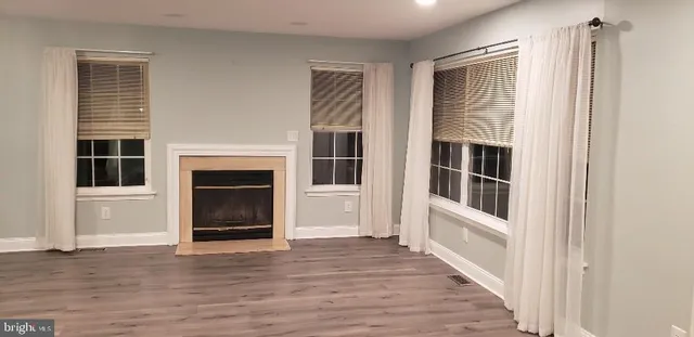 a view of an empty room with stairs