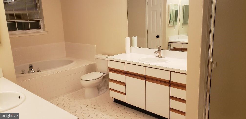 11 Castleton Road Princeton, NJ 08540 - Photo 6 of 7 a bathroom with a sink a toilet and shower