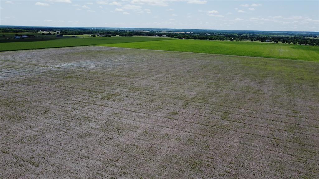 Lot 10 Cr103 Grandview, TX 76050 - Photo 2 of 5 a view of a golf course with a lake