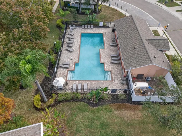 a view of a swimming pool with a lounge chair