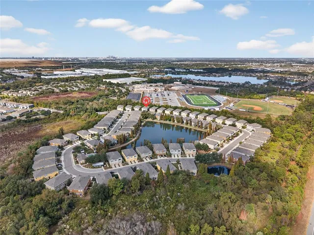 an aerial view of residential building and lake