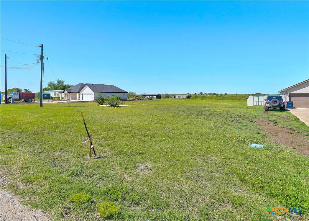 a view of a lake with a yard