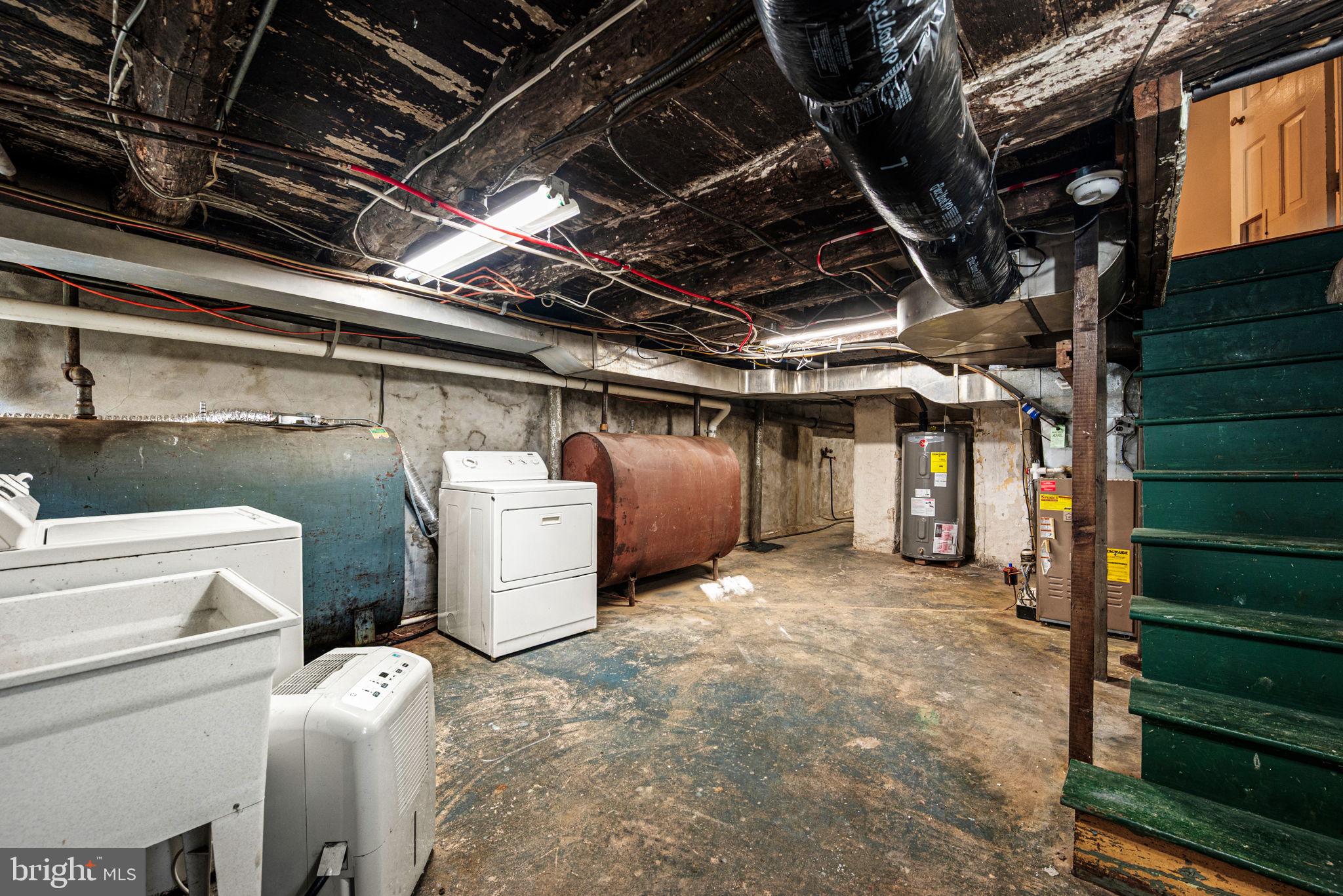 810 Crum Creek Road Media, PA 19063 - Photo 28 of 58 Laundry and oil tank in basement