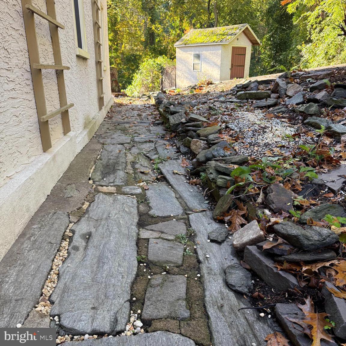 810 Crum Creek Road Media, PA 19063 - Photo 34 of 58 Stone path from kitchen door to drive and shed