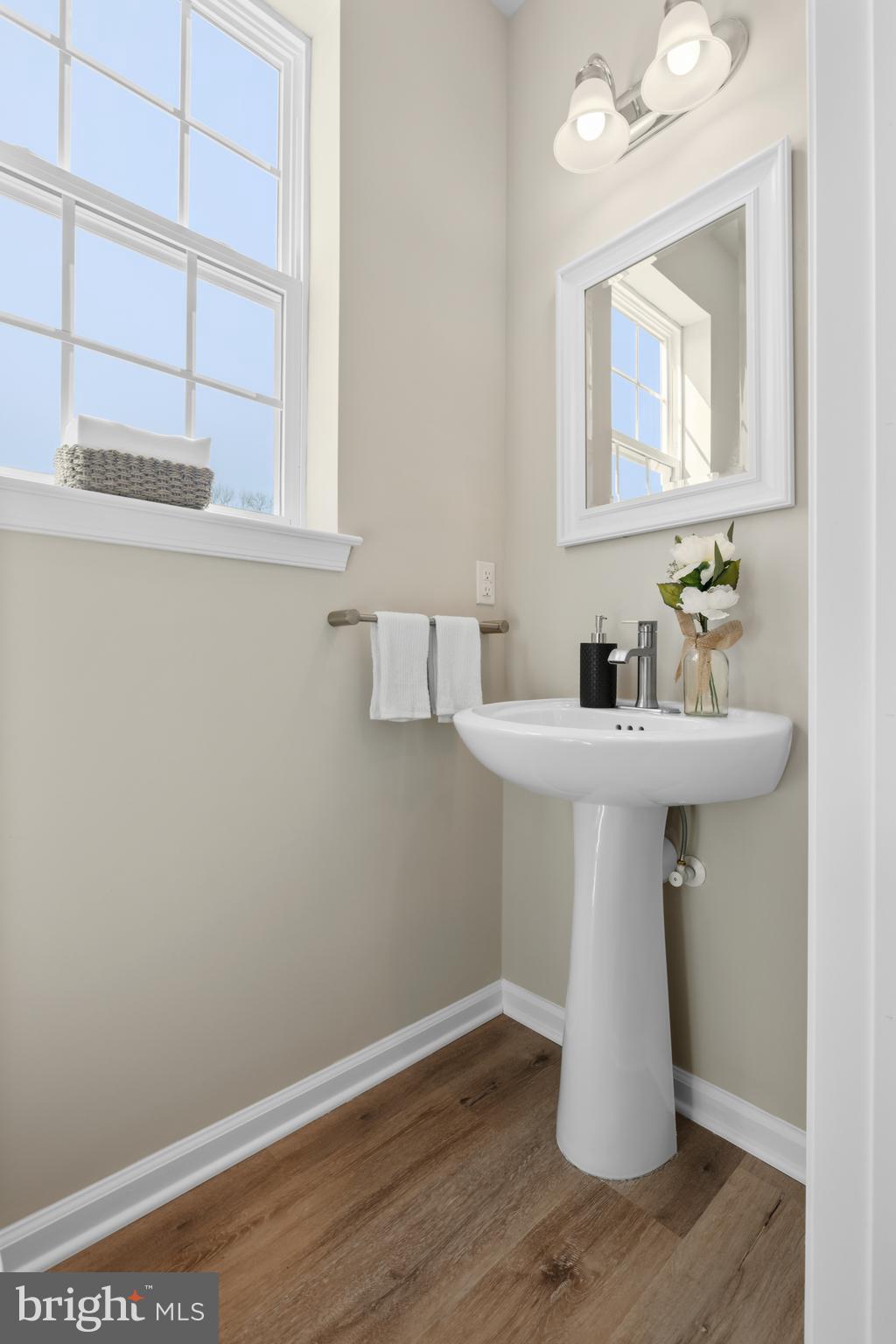 385 North Tuckahoe Road, Unit 961 Williamstown, NJ 08094 - Photo 11 of 21 a bathroom with a sink and a mirror