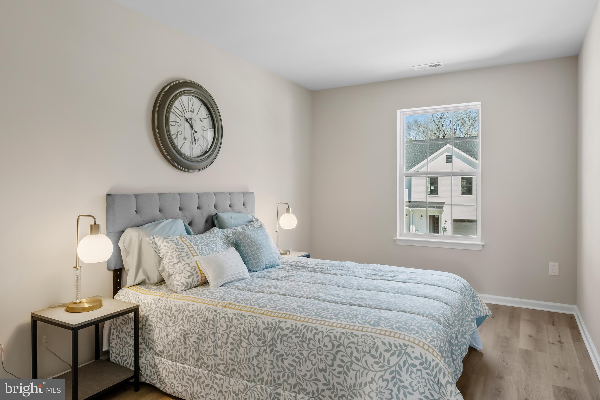 385 North Tuckahoe Road, Unit 961 Williamstown, NJ 08094 - Photo 18 of 21 a bedroom with a bed and painting on the wall