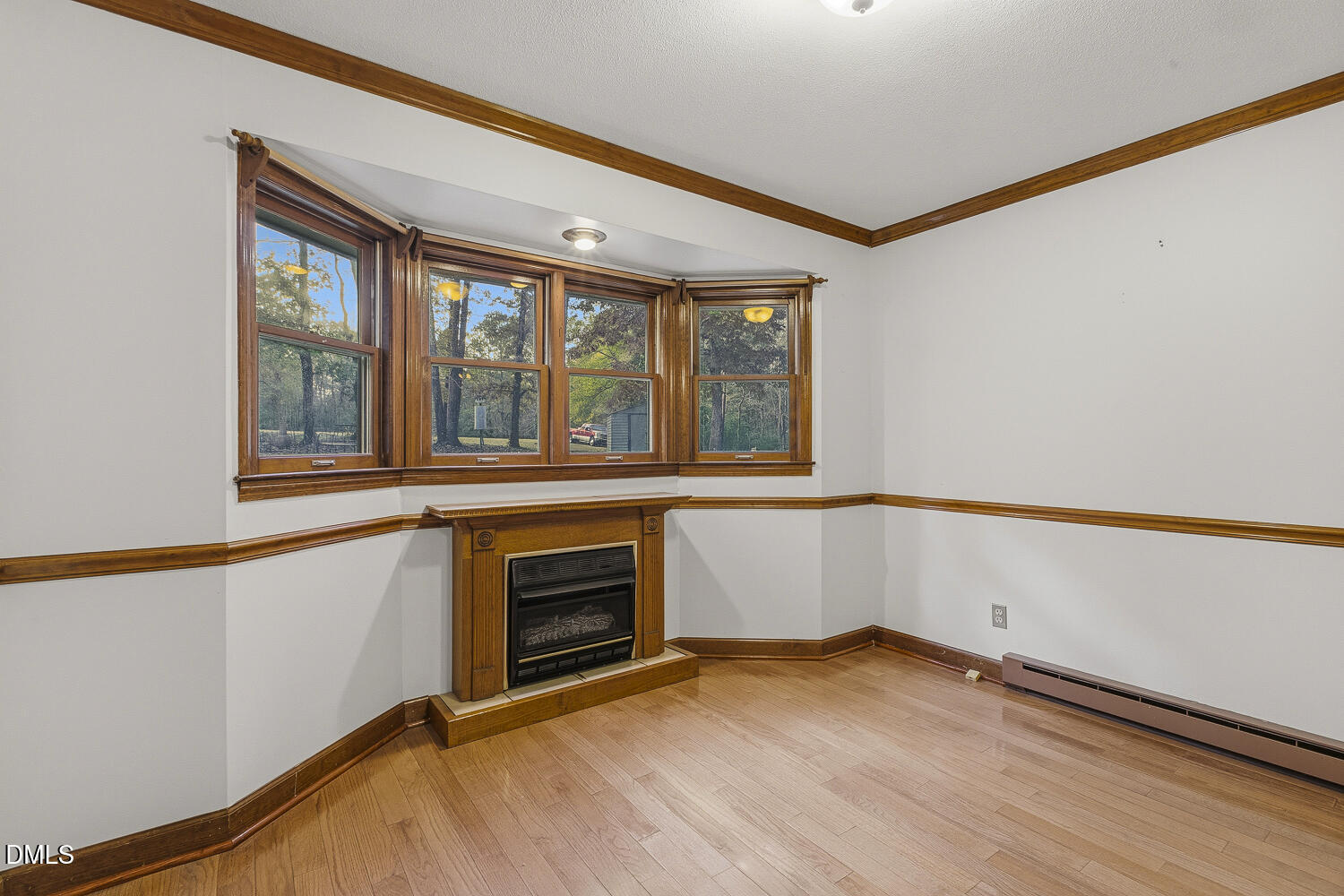 120 Elf Way Pittsboro, NC 27312 - Photo 9 of 68 a view of an empty room with a window and fireplace