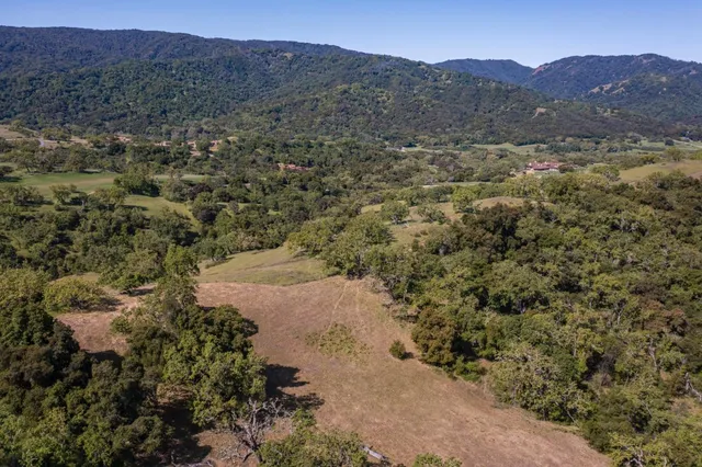 a view of a mountain with mountains in the background