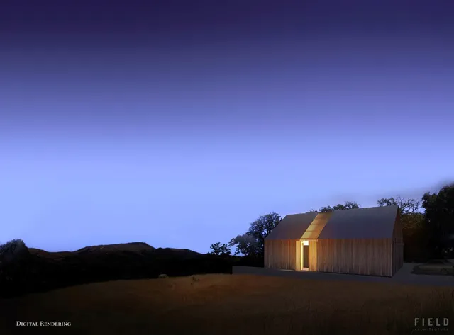 a view of a field of grass and trees