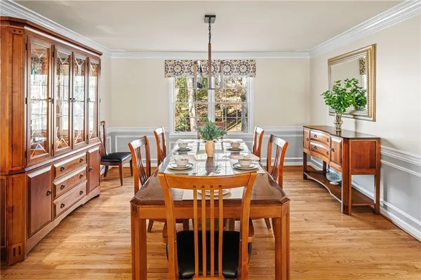a roof deck with couch and wooden floor