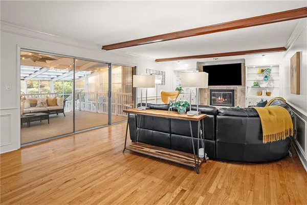 a spacious bedroom with a bed a couch and a window