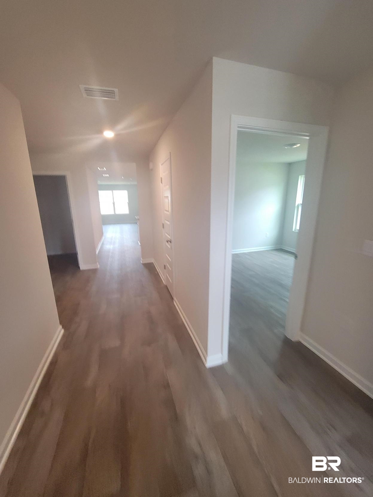 24625 Ponder Loop Loxley, AL 36551 - Photo 26 of 30 Corridor featuring dark hardwood / wood-style flooring