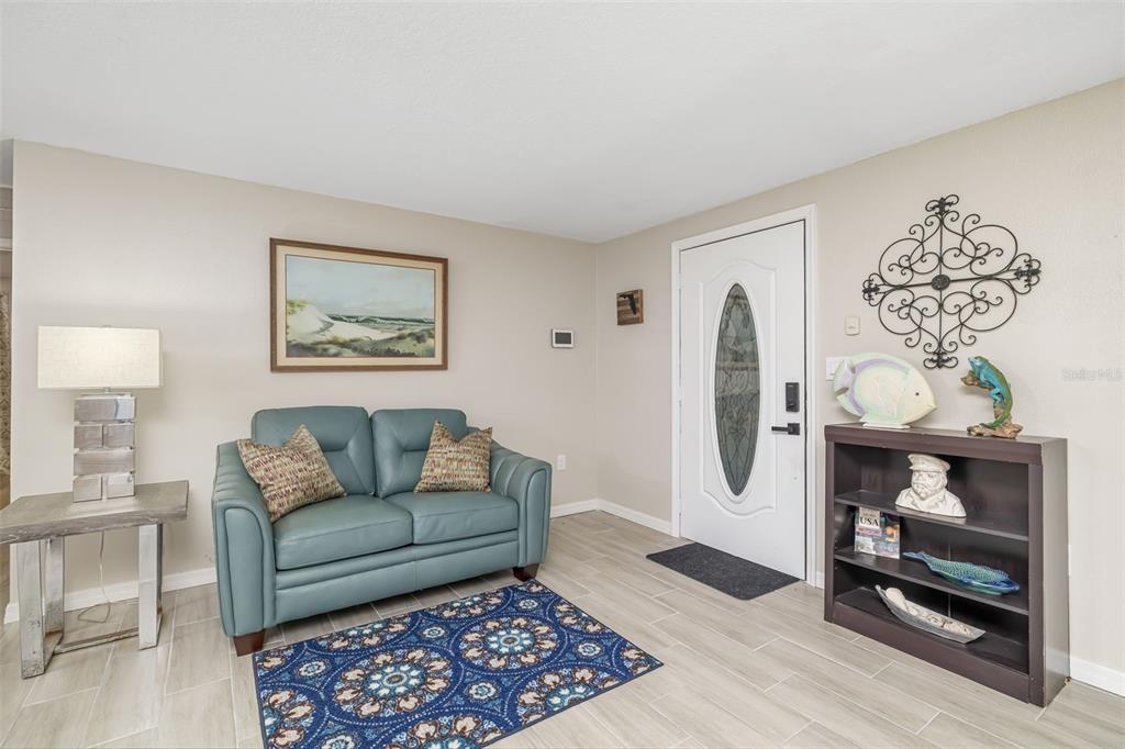 410 Pameto Road Nokomis, FL 34275 - Photo 11 of 40 a living room with furniture and a fireplace