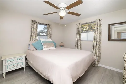 a bedroom with a bed and dresser