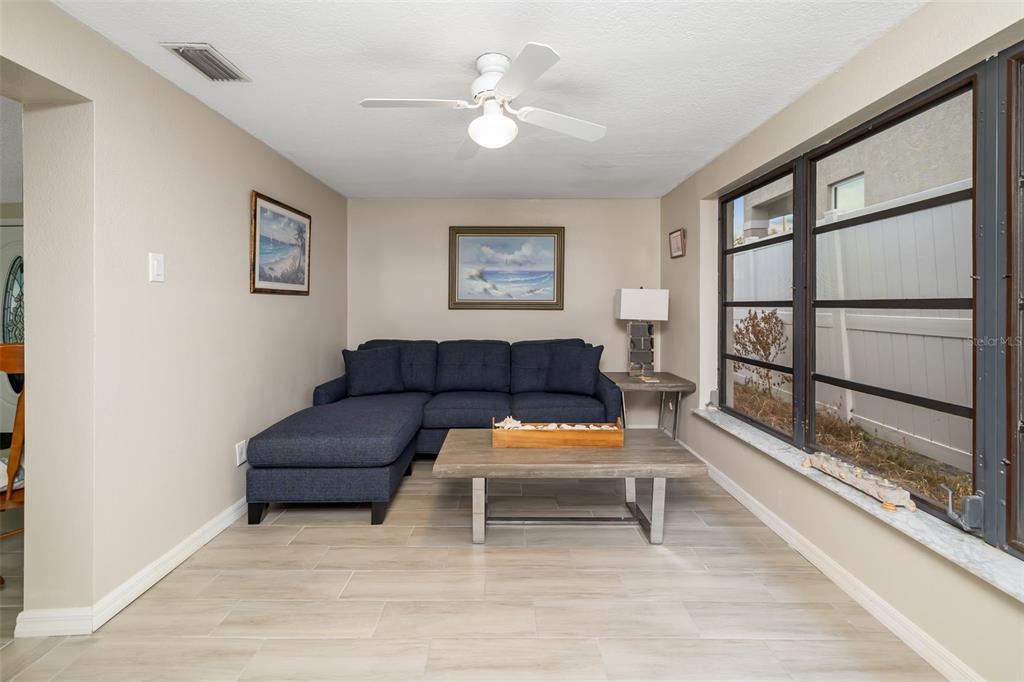 410 Pameto Road Nokomis, FL 34275 - Photo 31 of 40 a living room with furniture and a large window