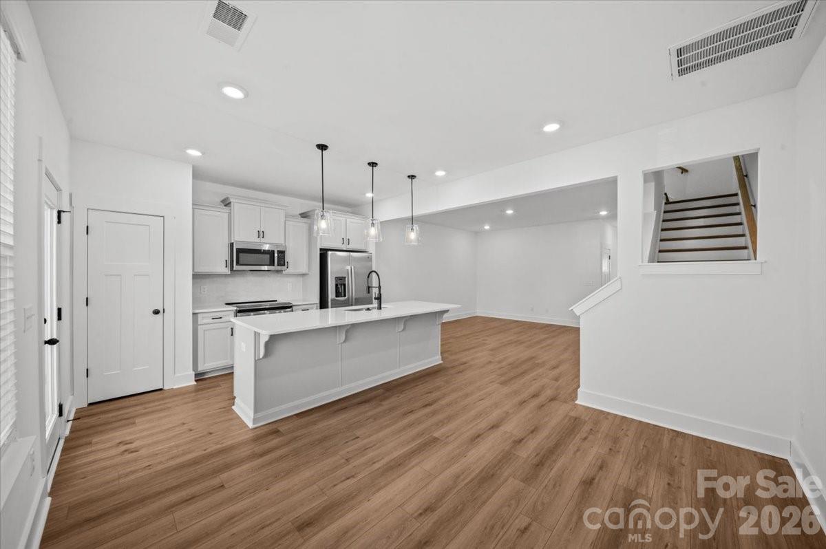 49 Moon Hvn Way Arden, NC 28704 - Photo 3 of 30 a large kitchen with a lot of counter space and wooden floor