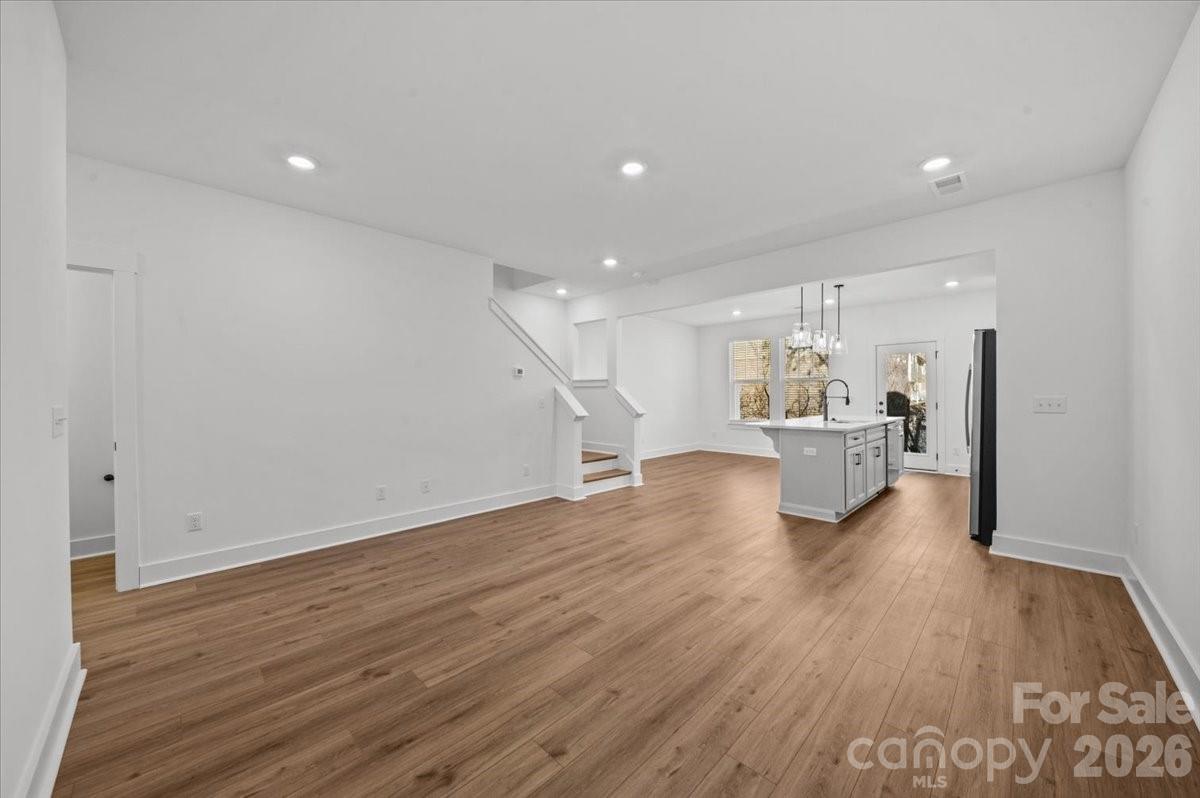 49 Moon Hvn Way Arden, NC 28704 - Photo 8 of 30 a view of kitchen and hall with wooden floor