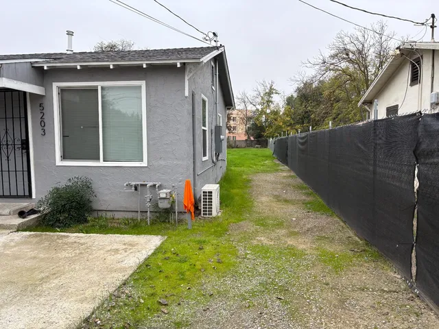 a house view with a garden space