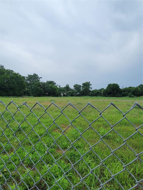 4719 Collins Avenue Dallas, TX 75210 - Photo 2 of 5 a view of a field and buildings in the background