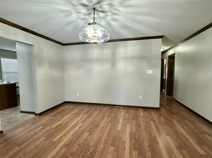 a kitchen with stainless steel appliances granite countertop a stove sink and cabinets