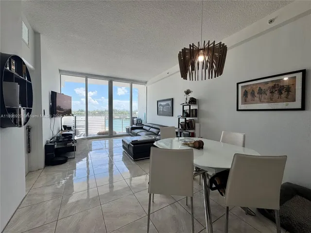 a living room with fireplace furniture and a flat screen tv