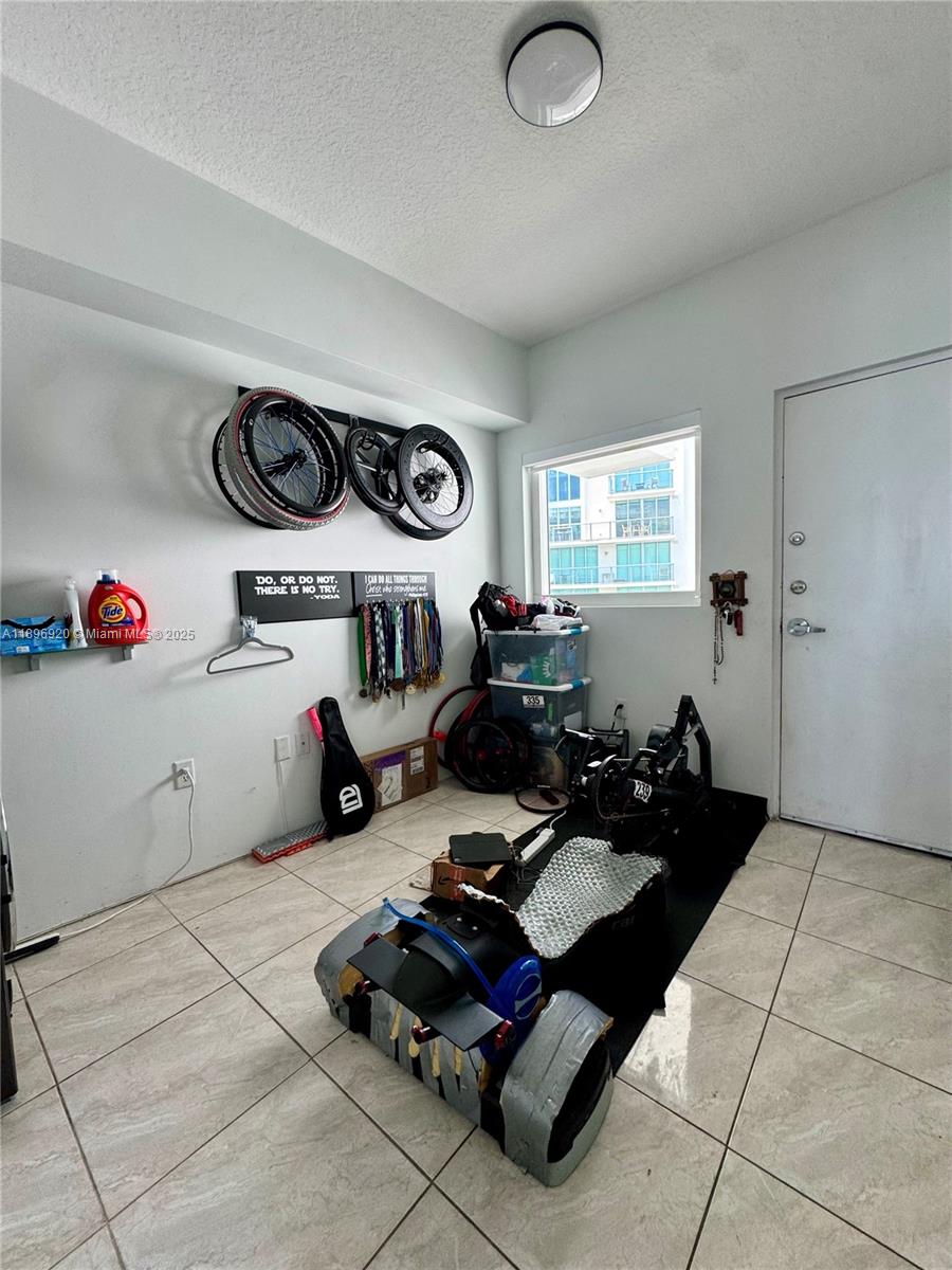 6580 Indian Creek Drive, Unit 404 Miami Beach, FL 33141 - Photo 16 of 19 a living room with furniture and a window