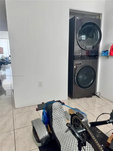 a living room with a couch and a stove top oven