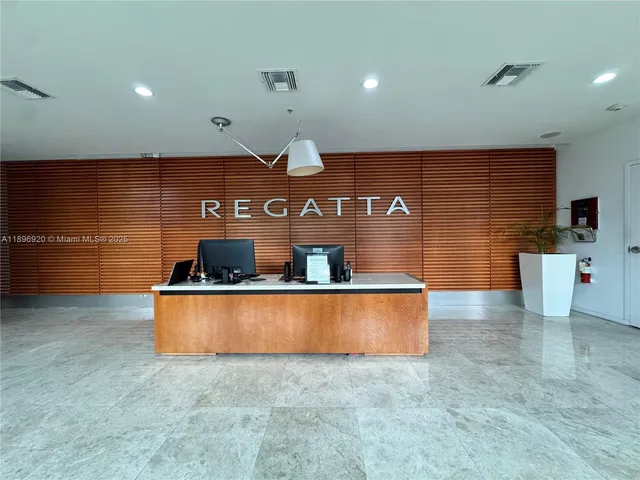 a room with stainless steel appliances wooden cabinets and a counter top space