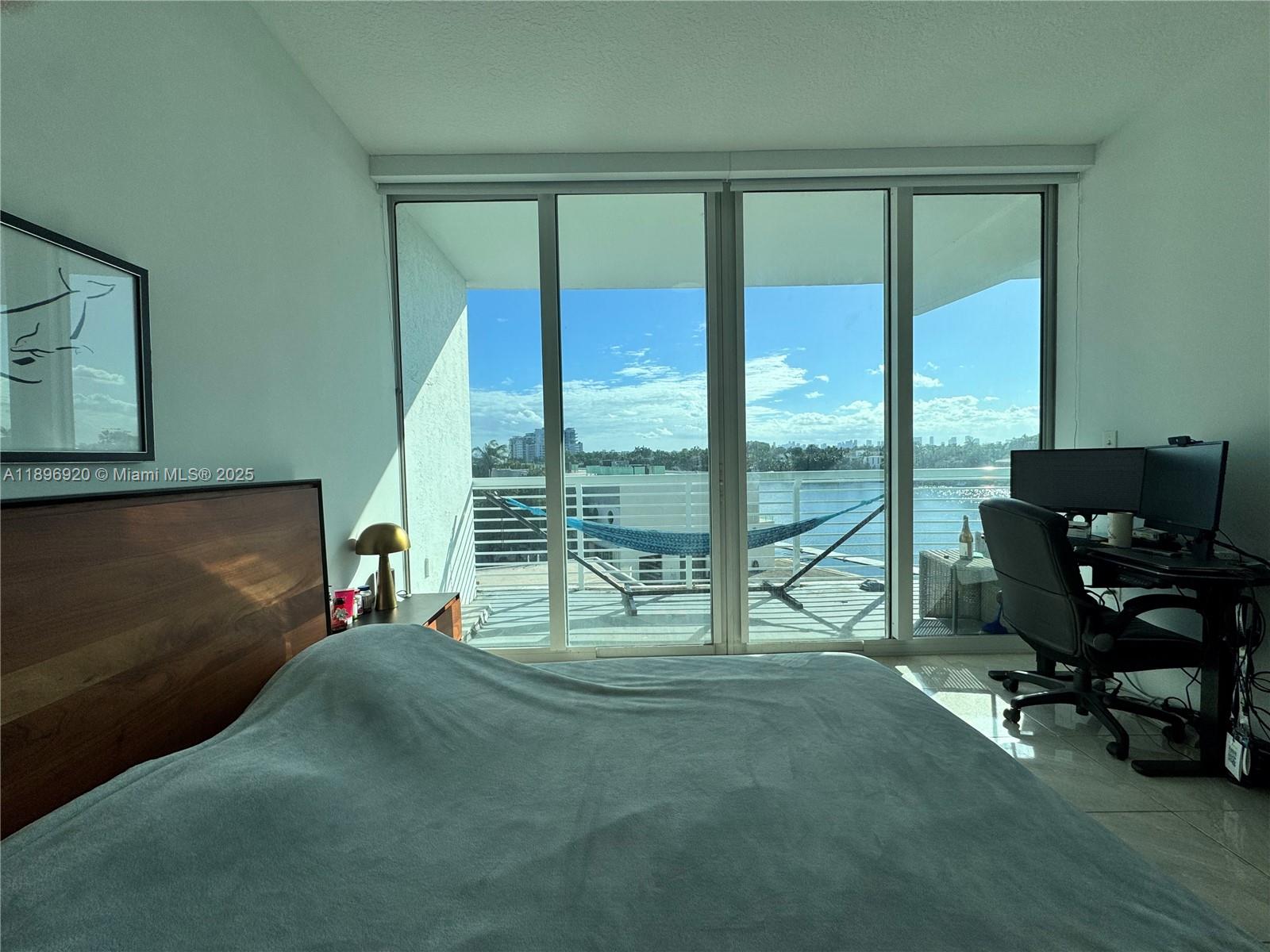 6580 Indian Creek Drive, Unit 404 Miami Beach, FL 33141 - Photo 3 of 19 a living room filled with furniture and a floor to ceiling window