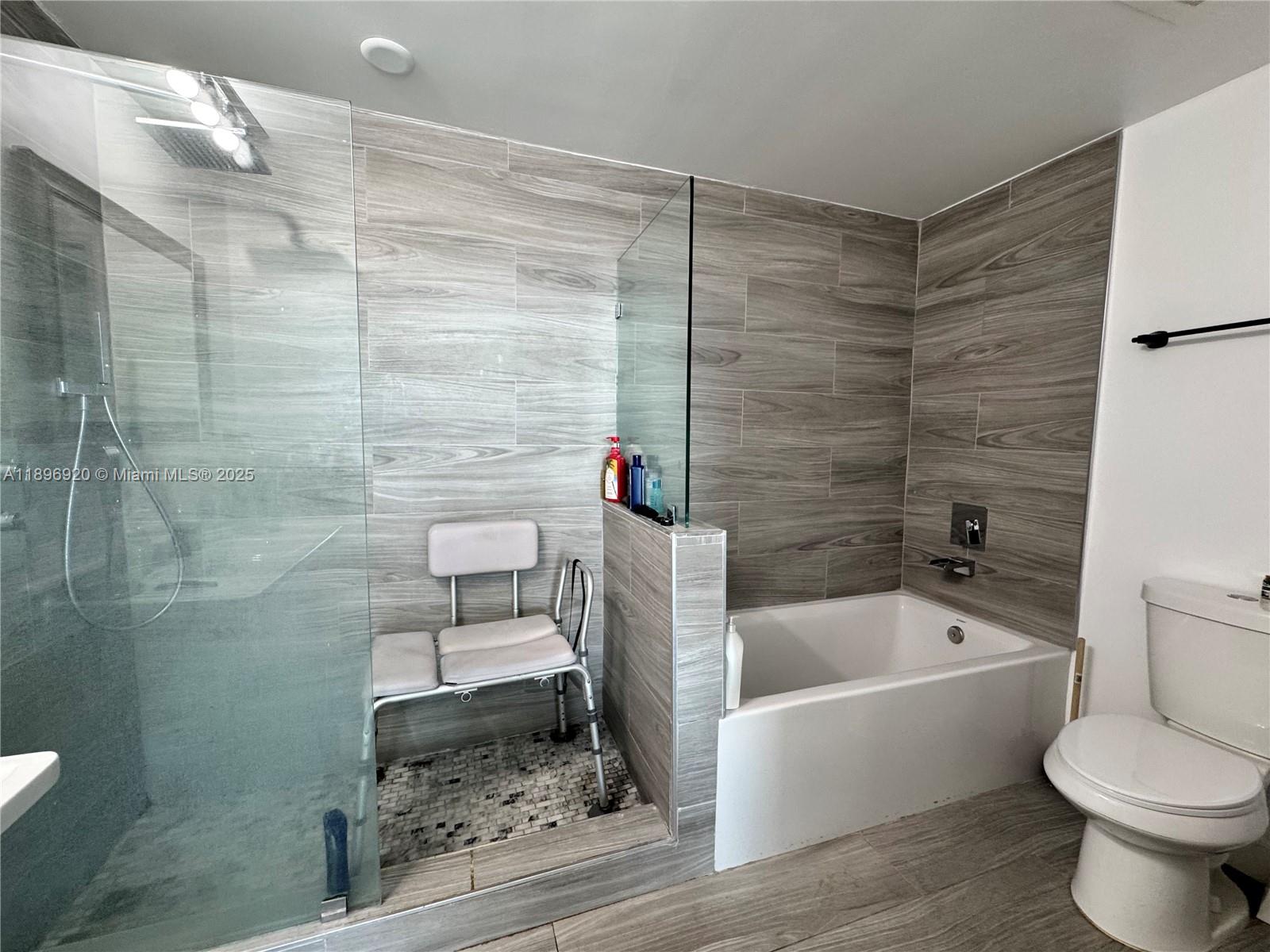 6580 Indian Creek Drive, Unit 404 Miami Beach, FL 33141 - Photo 5 of 19 a bathroom with a toilet and a bathtub