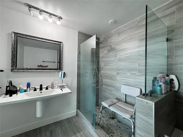 a kitchen with a refrigerator and sink