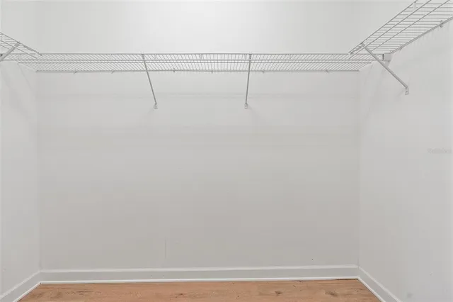 a bathroom with a granite countertop sink a bathtub and a shower