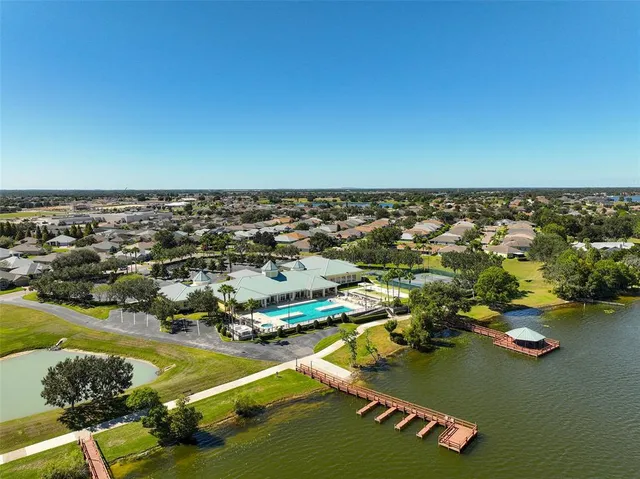 an aerial view of a ocean with beach