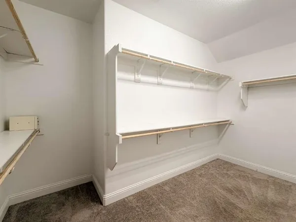 a view of an empty walk in closet