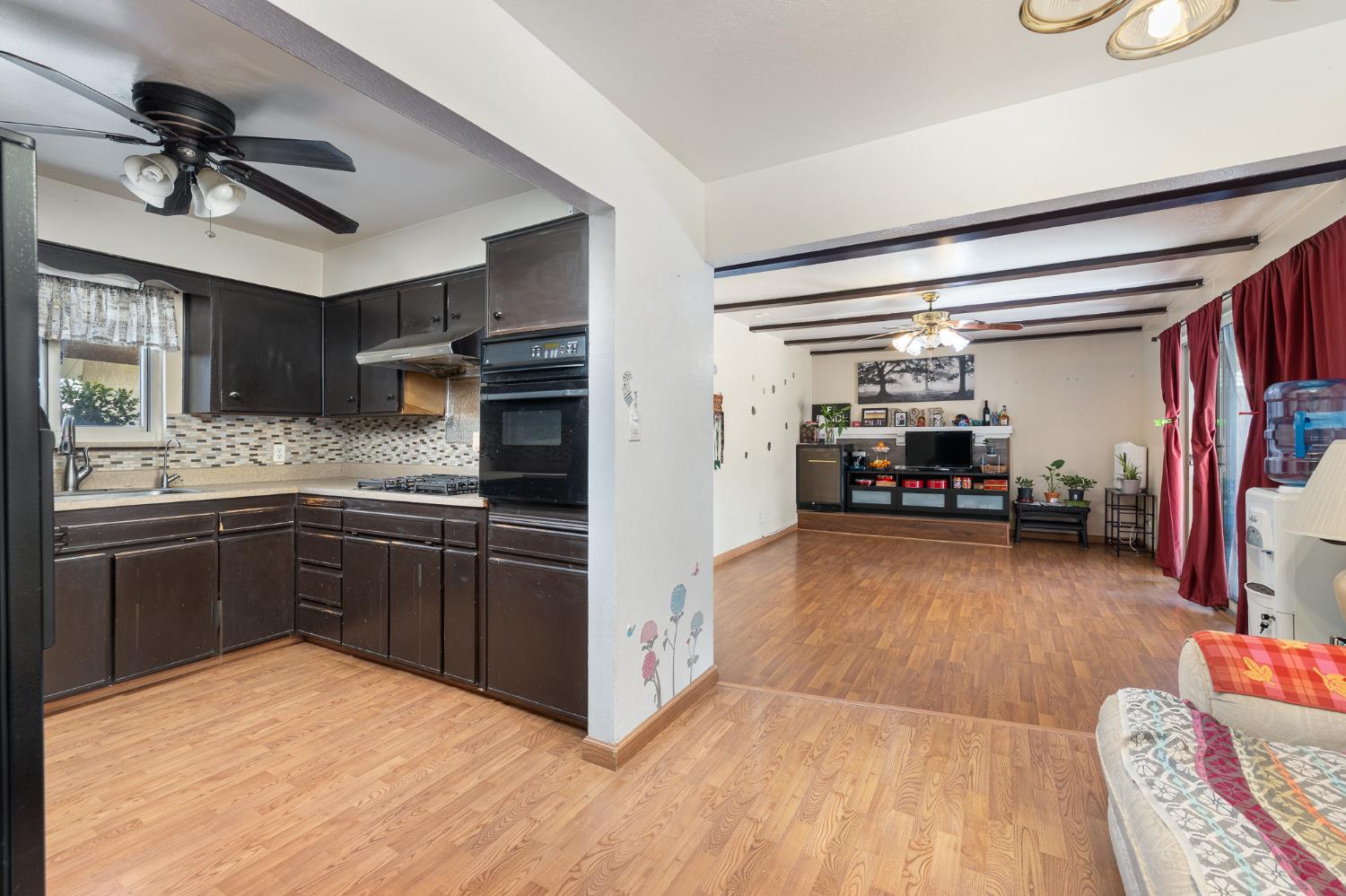 4683 North Angus Street Fresno, CA 93726 - Photo 11 of 27 a kitchen with stainless steel appliances granite countertop a refrigerator and stove top oven