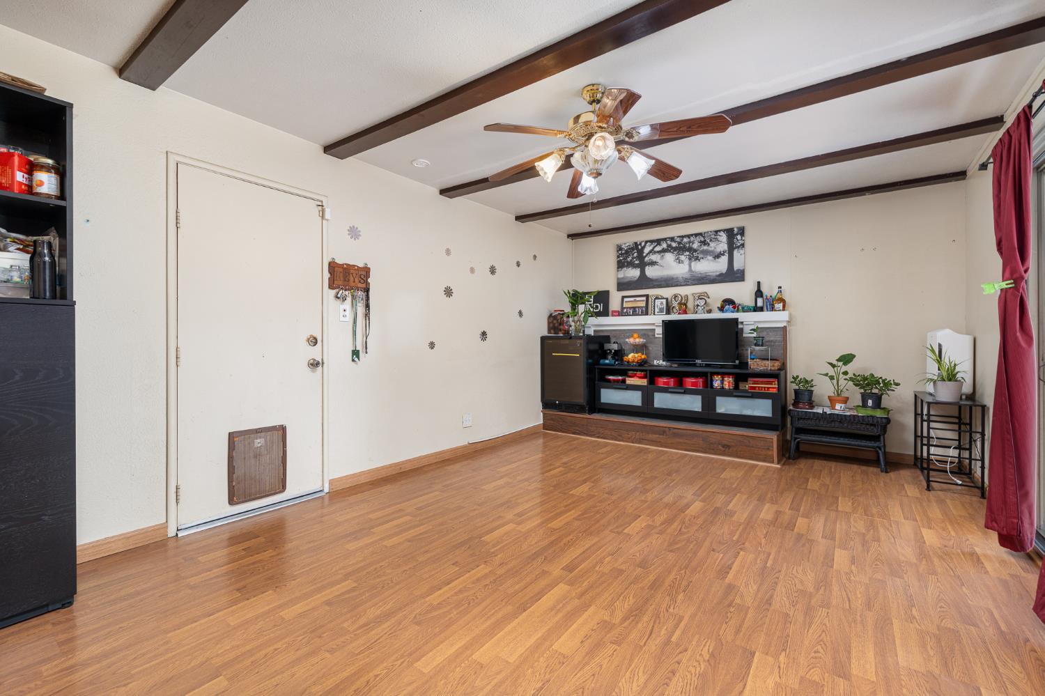 4683 North Angus Street Fresno, CA 93726 - Photo 12 of 27 a view of a livingroom with furniture and a flat screen tv