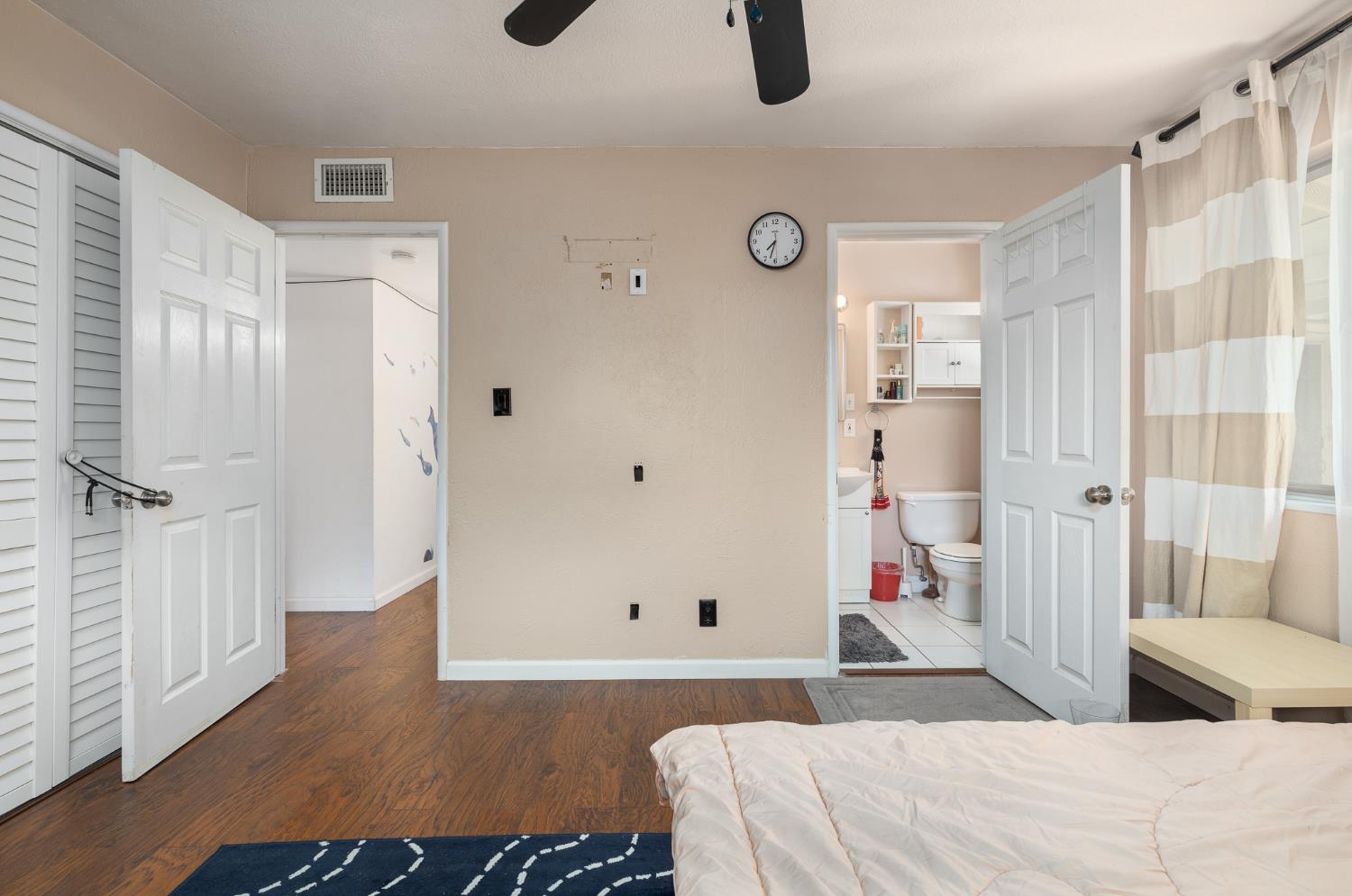 4683 North Angus Street Fresno, CA 93726 - Photo 16 of 27 a bedroom with a bed and a couch