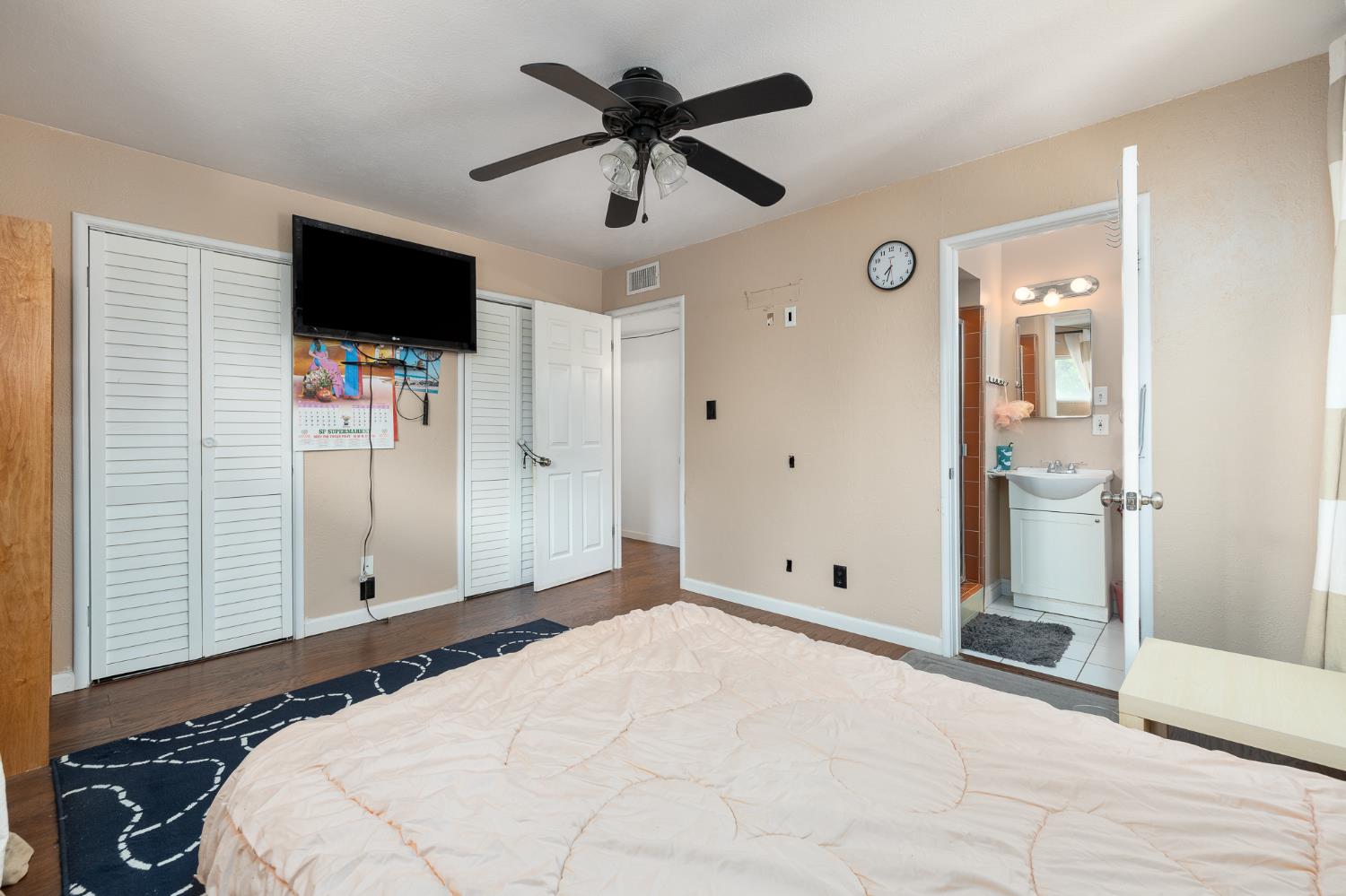 4683 North Angus Street Fresno, CA 93726 - Photo 18 of 27 a room that has a bed and a flat screen tv