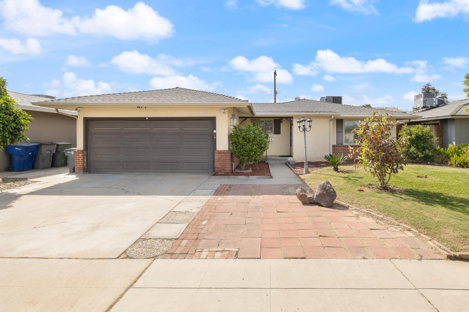 4683 North Angus Street Fresno, CA 93726 - Photo 2 of 27 a view of a patio with a table and chairs under an umbrella