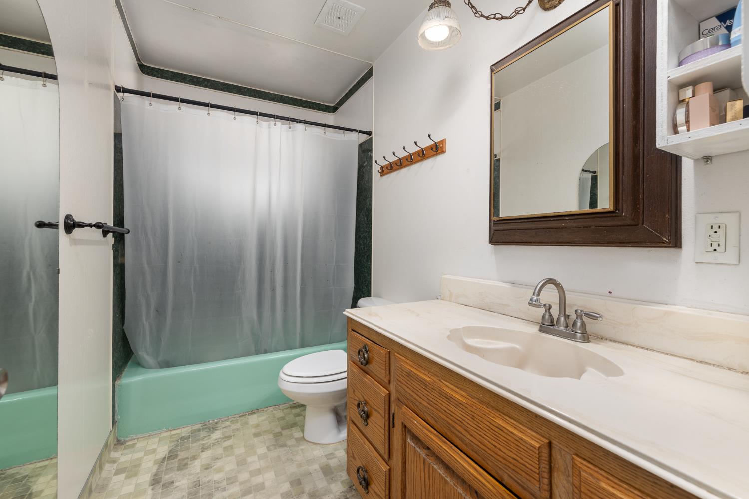 4683 North Angus Street Fresno, CA 93726 - Photo 21 of 27 a bathroom with a sink a toilet and shower