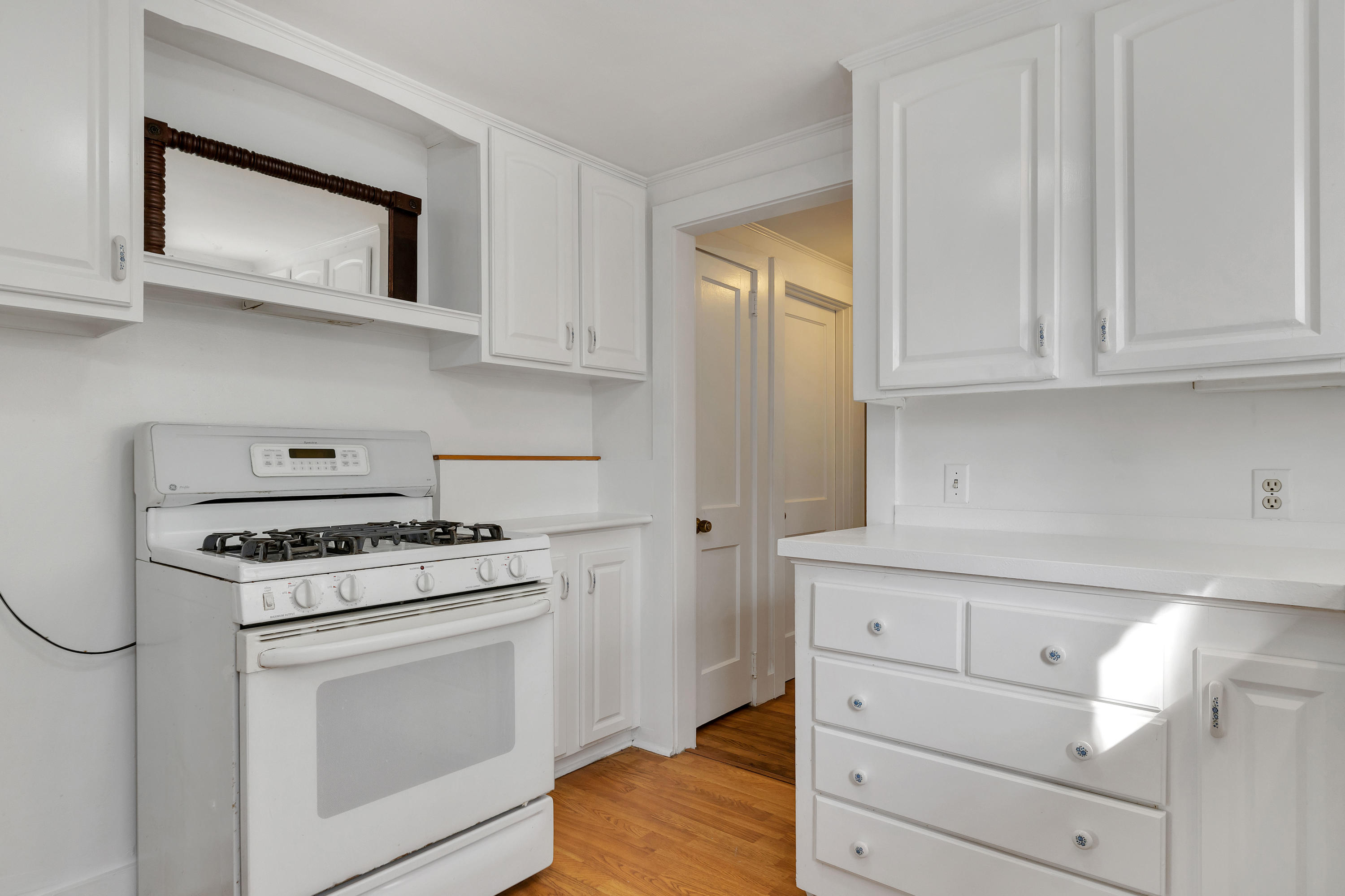 54 Murphy Road Hyannis, MA 02601 - Photo 11 of 24 a kitchen with white cabinets and white appliances
