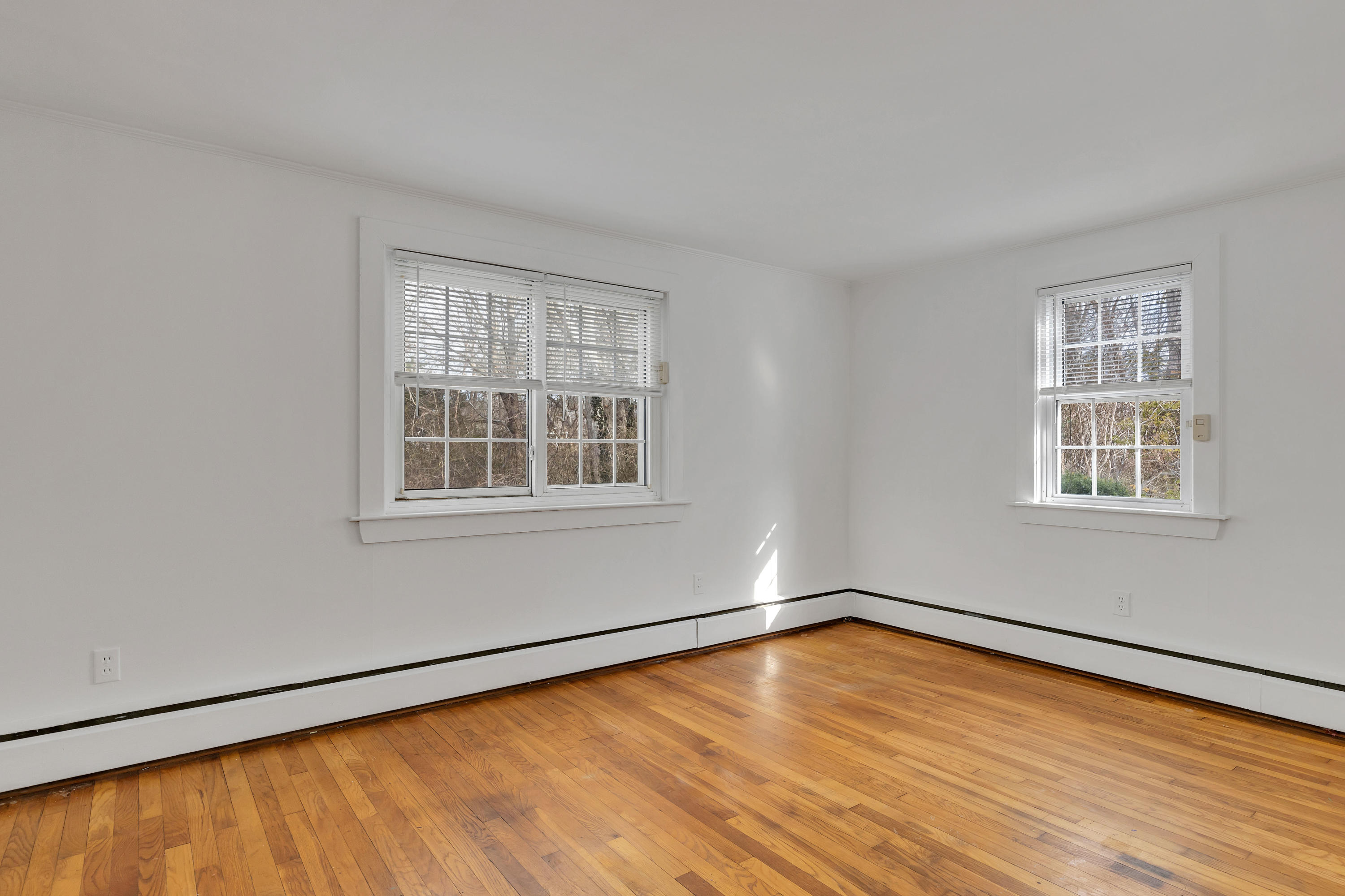 54 Murphy Road Hyannis, MA 02601 - Photo 13 of 24 a view of empty room with wooden floor and fan