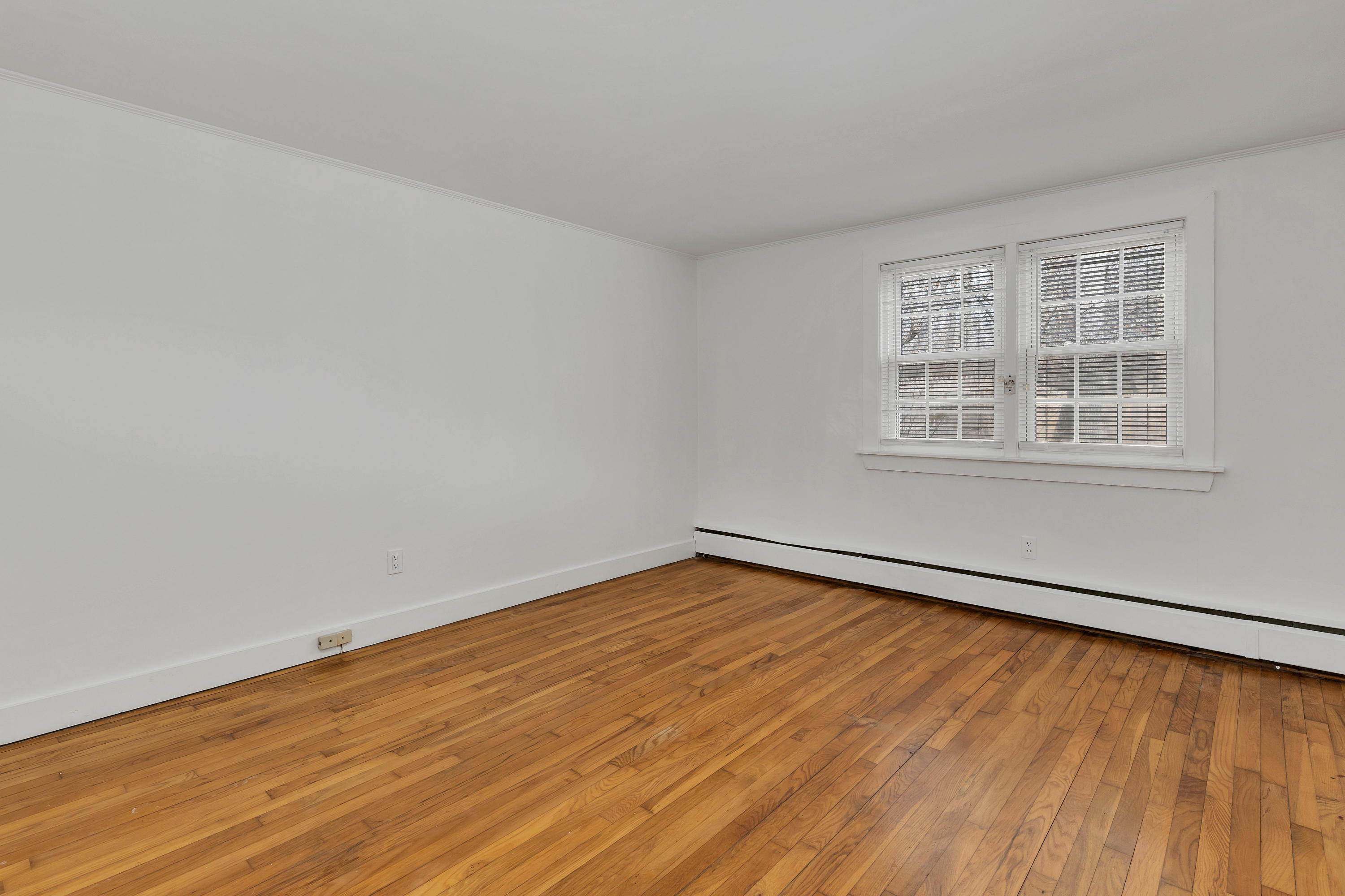 54 Murphy Road Hyannis, MA 02601 - Photo 15 of 24 an empty room with wooden floor and windows