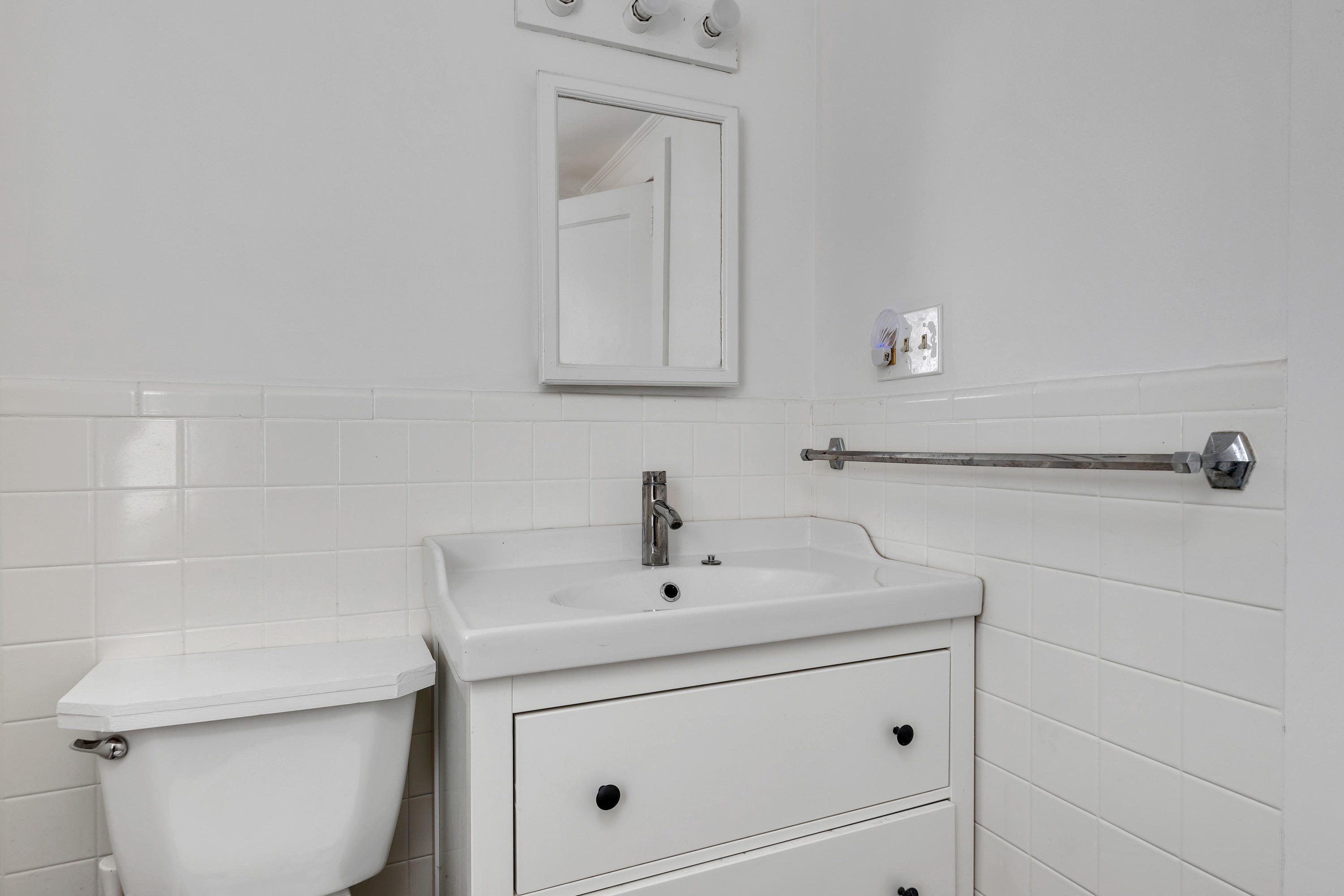 54 Murphy Road Hyannis, MA 02601 - Photo 16 of 24 a bathroom with a toilet sink and mirror