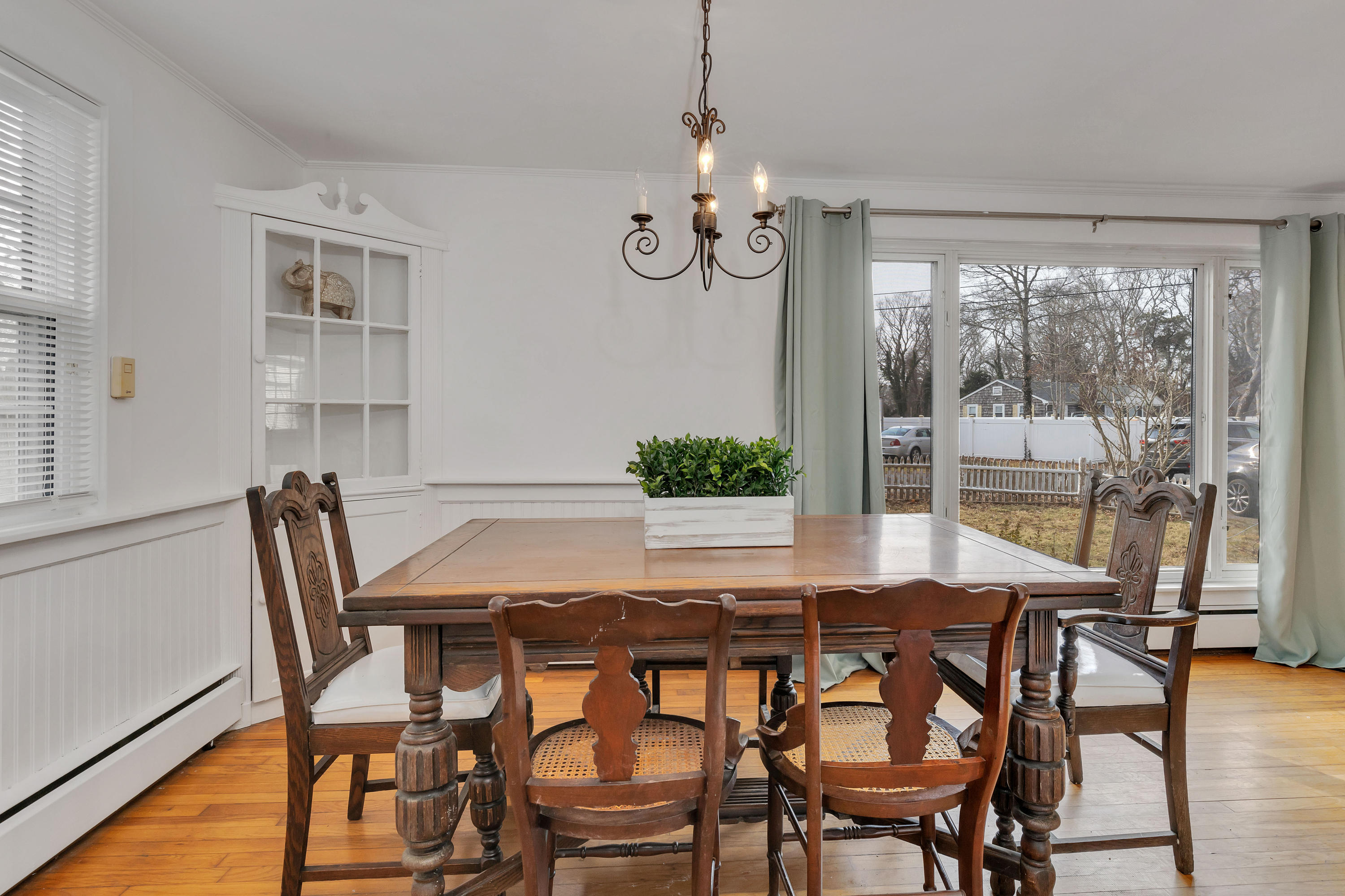54 Murphy Road Hyannis, MA 02601 - Photo 9 of 24 a view of a dining room with furniture wooden floor and a chandelier