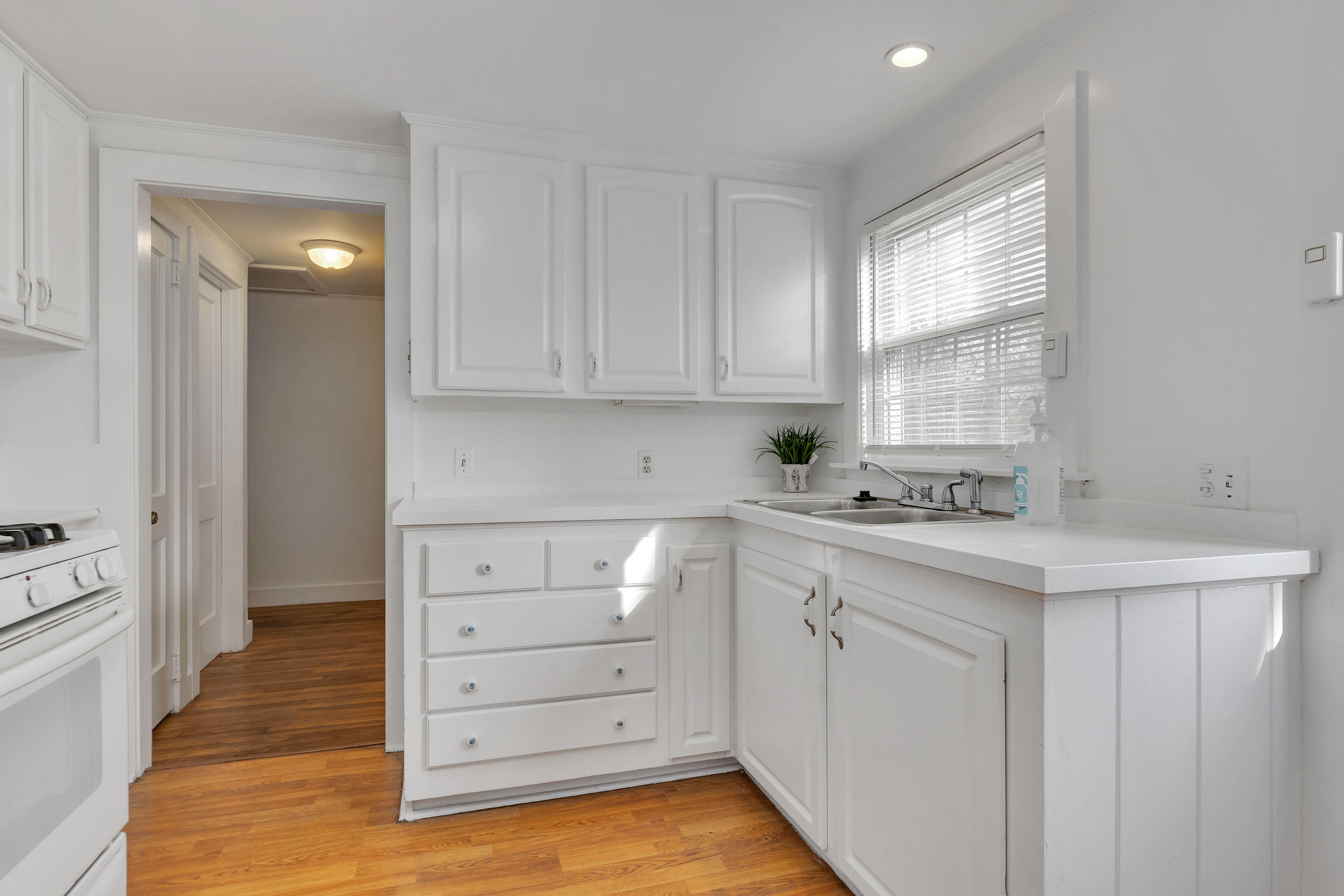 54 Murphy Road Hyannis, MA 02601 - Photo 10 of 24 a kitchen with white cabinets and sink