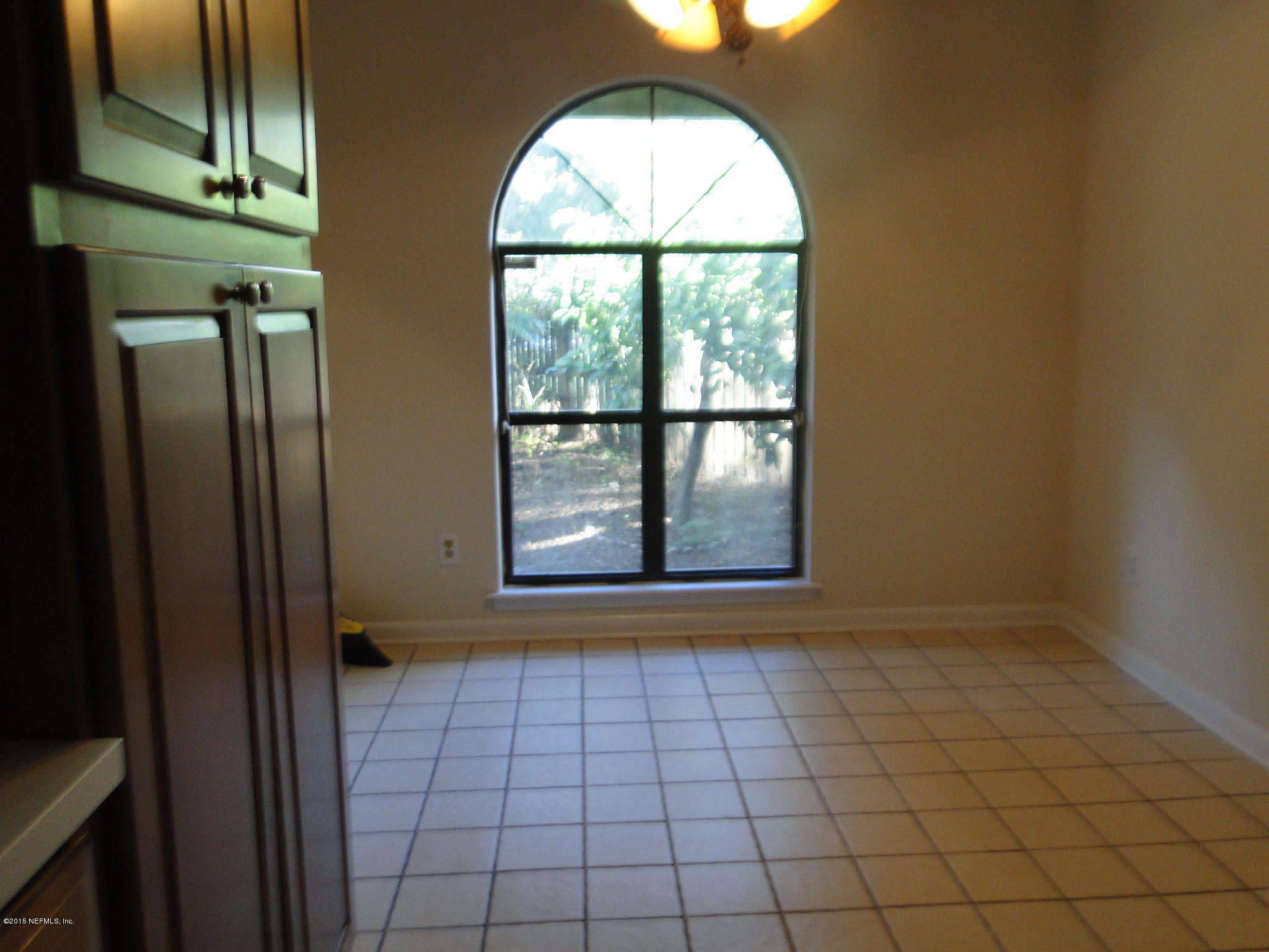 5496 Spring Brook Road Jacksonville, FL 32277 - Photo 11 of 25 an empty room with windows
