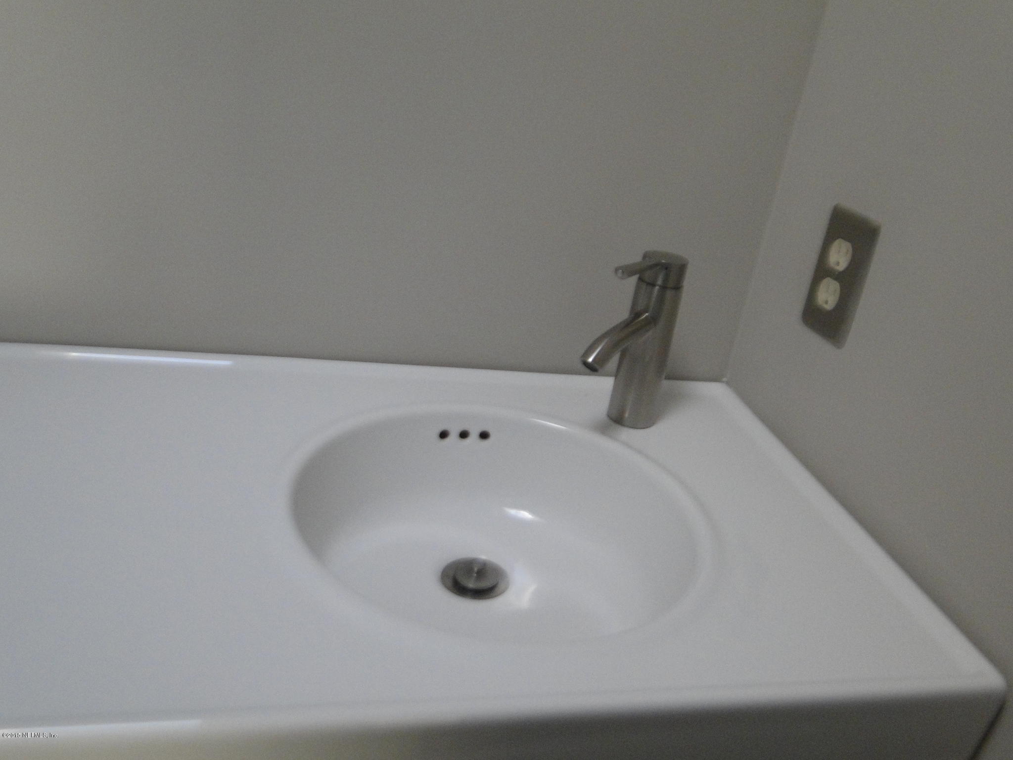 5496 Spring Brook Road Jacksonville, FL 32277 - Photo 16 of 25 a bathroom with a sink